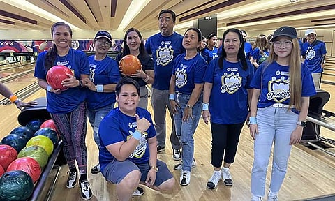 HAIL THE CHAMPS. Team Pink celebrates their victory as Estela B. Aguilos, Santos Land Development (SLDC) Business Group head, left, presents them with the P20,000 champion’s prize for topping the SLDC 53rd anniversary bowling tournament during the awarding ceremony at the company’s third-quarter recognition and anniversary celebration, held at the Grand Men Seng Hotel on Friday evening, October 25, 2024. Also in the photo is Mary Ann Plana, right, SLDC’s corporate planning head.