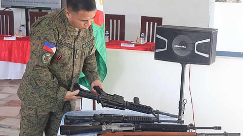 ZAMBOANGA. Ten members of the Bangsamoro Islamic Freedom Fighters (BIFF) surrender and turn over high-powered firearms to Joint Task Force (JTF)-Central troops on Friday, November 15, 2024, in Zapakan village, Radjah Buayan, Maguindanao del Sur. A photo handout shows Brigadier General Oriel Pangcog, 601st Infantry Brigade commander, inspected the weapons the 10 BIFF have turned over when they surrendered to the troops. (SunStar Zamboanga)