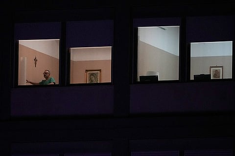 A man walks in the ward where Pope Francis is hospitalized at the Agostino Gemelli Polyclinic, in Rome, Italy, Sunday, March 2, 2025.