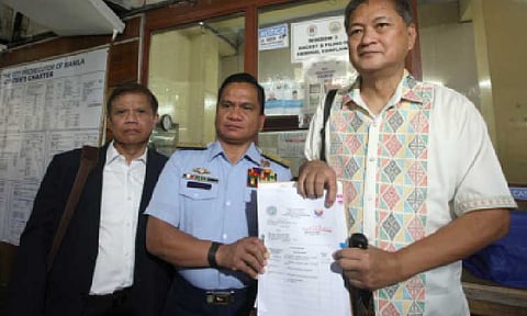 CYBERLIBEL CASE. Philippine Coast Guard Spokesperson for the West Philippine Sea Commodore Jay Tarriela (center) files a cyberlibel case against blogger Sass Sasot before the Manila Prosecutor's Office at the city hall on Friday (July 4, 2025). Tarriela said the complaint is in response to a series of "baseless, malicious, and deeply personal online attacks" made by Sasot against him between July and October last year. (PNA photo by Yancy Lim)