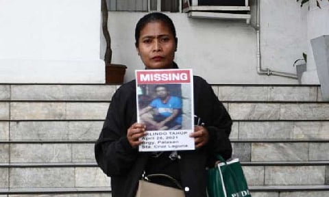 MISSING. A family member shows a picture of her relative, who is among the scores of missing sabungeros (cockfight afficionados), before a meeting with Department of Justice officials on Friday (July 5, 2025). Justice Secretary Jesus Crispin Remulla assured the families of the missing men that the DOJ is exerting all efforts to solve the case.