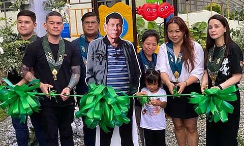 THE RIBBON-CUTTING. From left, Acting Vice Mayor Rigo Duterte, Acting Mayor Sebastian Duterte, Councilor Al Ryan Alejandre, City Social Welfare and Development Office chief Julie Dayaday, Krizette Laureta Chu, and Jasmin Egan.