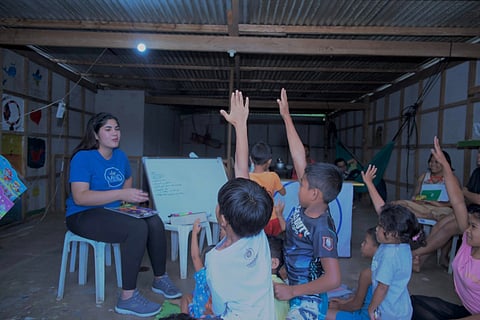 Making New Dreamers founder and Mutya ng Dabaw 2024 Hanna Maj Piccio leads a teaching session with the Obu Manuvu children in Sitio Macatabo, Barangay Carmen, Baguio District, Davao City.