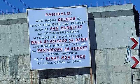 A photo was released on August 2, 2025, by Davao City radio commentator Jun Digamon, showing a large tarpaulin displayed at the ongoing Maa Flyover construction site, revealing the reason behind the project's delay.