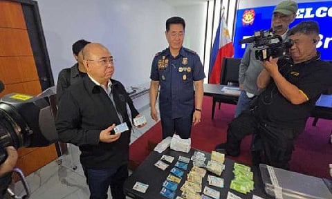 ILLEGAL SELLERS. Land Transportation Office chief Vigor Mendoza shows fake driver's licenses at a briefing at Camp Crame in Quezon City on Wednesday (Sept. 10, 2025). Mendoza said the agency is considering filing criminal charges against two Department of Public Works and Highways (DPWH) engineers implicated in the flood control project mess for allegedly using fake driver's licenses to enter casinos. (PNA photo by Lloyd Caliwan)