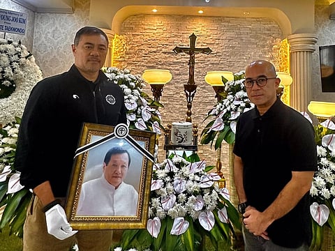 TRIBUTE. Philippine taekwondo Olympians Monsour del Rosario and Stephen Fernandez pay tribute to the late Grand Master Kim Hyuong Joo, the “Father of Mindanao Taekwondo.”
