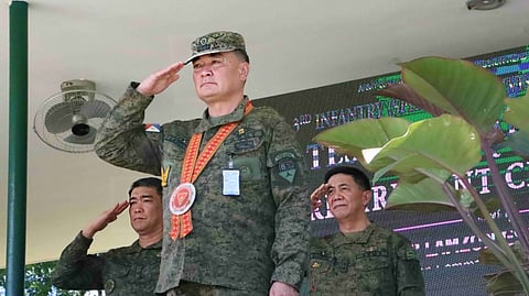 The 3rd Infantry (Spearhead) Division (3ID) of the Philippine Army through Major General Michael G. Samson (right), commander of the 3ID pays tribute to Colonel Erwin Rommel P. Lamzon (center), outgoing Assistant Division Commander for Administration and chief of the Division Public Affairs Office (3DPAO), during his retirement ceremony on September 19, 2025, at Camp General Macario B. Peralta Jr., Jamindan, Capiz.(Photo courtesy of 3rd Infantry Division)