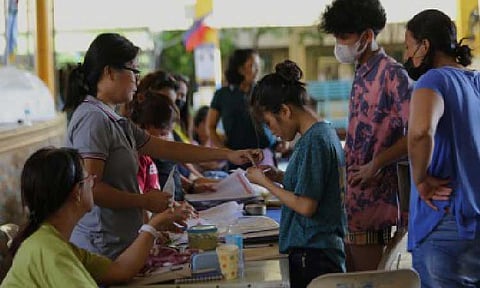 UNIFIED DATA SYSTEM. Enrollment at Batasan Hills National High School in Batasan Road, Quezon City in an undated photo. The Department of Education, Commission on Higher Education, and Technical Education and Skills Development Authority have signed an agreement to establish a unified and interoperable data system that will track Filipino learners from their first day in school to their entry into the workforce. (PNA photo by Joan Bondoc)