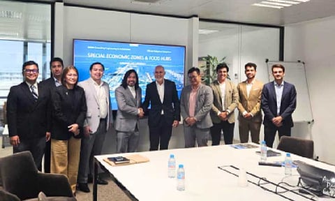 PARTNERSHIP. Aurora Pacific Economic Zone and Freeport Authority president and chief executive officer lawyer Gil Taway (5th from left) and IDOM director for logistics and operations Jaume Mas Vilella shake hands after a meeting in Spain as part of APECO’s investment mission on Sept. 29 to Oct. 3, 2025. The high-level team from APECO secured commitments from IDOM officials for the planned development of a five to 10-hectare food and cold chain logistics hub in the ecozone. (Photo courtesy of APECO)