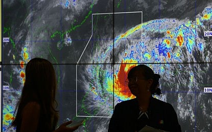 TRACKING UWAN. The Philippine Atmospheric, Geophysical and Astronomical Services Administration monitors the movements of Super Typhoon Uwan at its headquarters in Quezon City on Saturday (Nov. 8, 2025). The state weather bureau warned that Uwan (international name Fung-wong) could bring violent winds, torrential rain, and storm surges up to three meters high.