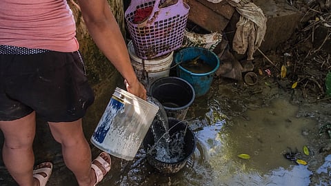 Residents of Purok Mangga Uno in Barangay Cotcot, Liloan, are taking advantage of a deep well water to wash their clothes and clean their homes, as the water supply in the area has remained unavailable since the onslaught of Typhoon Tino on November 4, 2025. | via Juan Carlo de Vela