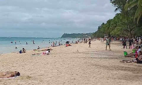 TOURIST HAVEN. Tourists enjoy Boracay Island in this undated photo. The Department of Tourism on Tuesday (Jan. 20, 2026) reported that the Philippines recorded 6.5 million foreign visitors and returning overseas Filipinos in 2025, generating an estimated PHP694 billion in tourism revenue. (PNA file photo by PGLena)