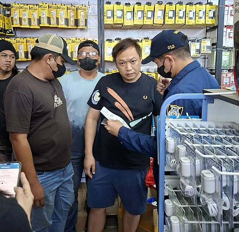 ZAMBOANGA. Lawmen arrest a Chinese national (2nd from right) on Monday, February 2, in a joint law enforcement operation along Maria Clara Street, Zone 3 village, Zamboanga City.
