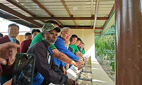 CLEAN WATER INITIATIVE: Floridablanca Mayor Michael Galang; Rotary Club of Dolores President Albert Lacanlale; Rotary Club of Saesongtan President Lee Jae Ho; District 3790 Immediate Past District Governor Ariel Jersey; District 3750 District Governor Moon-Ok Kang; RC Dolores Immediate Past President Maureen Gueco; and Nabuclod Barangay Chairman Romeo Alvaro, alongside other Rotary officers, test the new washing station at Camachile Elementary School. The facility is part of Rotary’s ₱5.7-million Water Resources and Sanitation Facility Project.