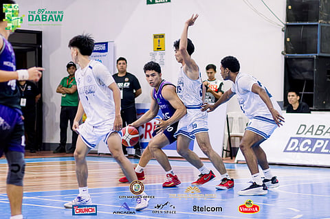 JMC KINGS WIN. A Jose Maria College (JMC) Kings player is defended by two San Pedro College (SPC) players during their opening-day matchup at the 89th Araw ng Dabaw Invitational Basketball Tournament, Thursday, March 12, at Almendras Gym, Davao City Recreation Center. The Kings won, 85-73.