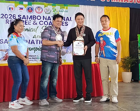 APPRECIATION. Dabawenyo Pilipinas Sambo Federation Inc. president Paolo Tancontian, second from left, presents a plaque of appreciation to Philippine Sports Commission (PSC) chairman John Patrick Gregorio during the opening of the 2026 National Sambo Referee and Coaches Technical Seminar and Sambo National Open Championships, at Sta. Ana National High School covered court.