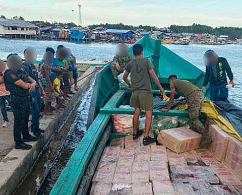 ZAMBOANGA. Troops of the 53rd Infantry Battalion seize a shipment of some P37.8 million worth of smuggled cigarettes during a security operation Wednesday, March 18, along the coastal waters of Kawit village, Pagadian City, the capital of Zamboanga del Sur province.