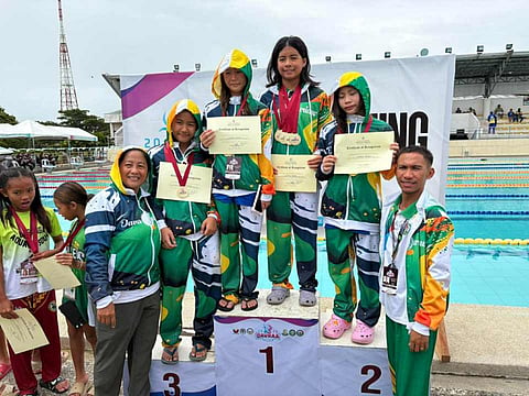 FILE PHOTO - Members of the Davao City Durians elementary girls’ swimming team pose with their medals and certificates after a podium finish during the Davao Regional Athletic Association (Davraa) Meet in Tagum City in February 2026. Some of these medalists will represent the Davraa Eagles in the upcoming Palarong Pambansa.