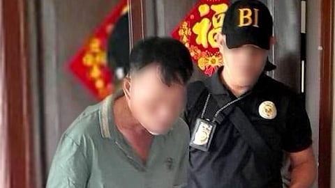 ZAMBOANGA. A personnel of the Bureau of Immigration escorts one of the four Chinese nationals the authorities arrested for violation of the Philippine immigration and public documentation laws in separate law enforcement operations in Zamboanga Peninsula.