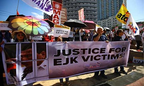SEEKING JUSTICE. Families and supporters of victims of alleged extrajudicial killings committed under the Duterte administration's drug war converge at the 11th World Scout Jamboree Memorial Rotonda in Quezon City on Feb. 23, 2026. The gathering coincided with the first day of the pretrial hearing of former president Rodrigo Duterte before the International Criminal Court in The Hague, the Netherlands. (PNA photo by Joan Bondoc)