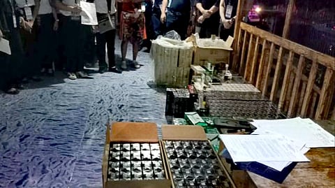 ILOILO. Operatives of the Iloilo Police Provincial Office, in coordination with the Bureau of Internal Revenue, display the 6,494 packs of illicit cigarettes worth P5.22 million seized during a joint operation that led to the arrest of a female suspect in Barangay Jolog, Estancia, Iloilo, on April 23, 2026.