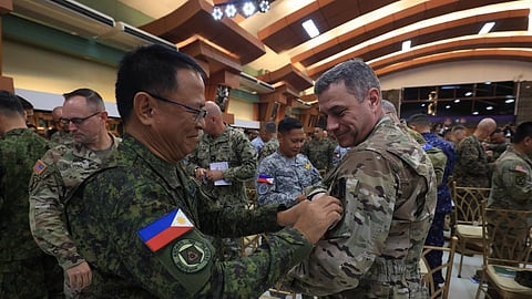 QUEZON CITY. Philippine Army Chief Lieutenant General Antonio G. Nafarrete links arms with top military officials from US, United Kingdom, Australia, Canada, France, Japan, and New Zealand in the opening ceremony of the 2026 Exercise Balikatan in Camp Aguinaldo, Quezon City on April 20, 2026.