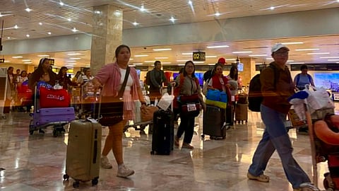 Passengers arrive at the Mactan Cebu International Airport, as strong travel demand continues despite rising concerns over fuel costs and potential flight disruptions linked to the Middle East tensions. /