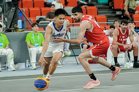 GILAS PUSHES THROUGH. Jeff Manday of Gilas Pilipinas 3x3 drives past an Iranian defender during the Philippines’ Pool A matchup in the men’s 3x3 basketball tournament at the 6th Asian Beach Games on Monday at the Sanya Sports Centre Gymnasium in Sanya, China. Gilas advanced to the quarterfinals despite a 14-21 loss to Iran.