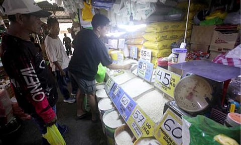 BLENDED RICE. Customers buy rice at a stall at the Paco Public Market in Manila on Apr. 15, 2026. The Department of Agriculture on Thursday (April 30) said it is eyeing the trial sale of blended local and imported rice in May to prevent possible spikes in retail rice prices. (PNA photo by Yancy Lim)