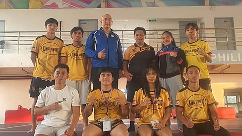 DAVAO CITY PRIDE. Members of King’s Sword Davao, bannered by national gold medalists Vince Dominguiano, Clarens Villacastin, Johanna Barbero, and Anthon Villarba, pose with team manager Nell Jone Astudillo and coach Arniel Barbero during the 2026 PSC Wushu Sanda National Championships in Manila. Davao City finished ninth overall with four gold medals, two silvers, and one bronze in one of its strongest national performances.