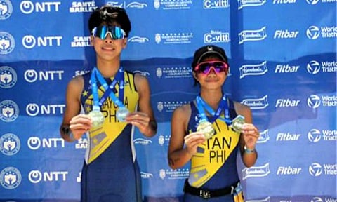 STANDOUTS. Diego Jose Dimayuga (left) and Lauren Lee Tan show their Under-15 gold medals during the awarding ceremony of the Subic Bay International Triathlon at Subic Bay Freeport Zone in Zambales on Sunday (May 3, 2026). Dimayuga will next see action at the Asian Youth Championships in Xuzhou, China on June 13 and 14. (PNA photo by Jean Malanum)