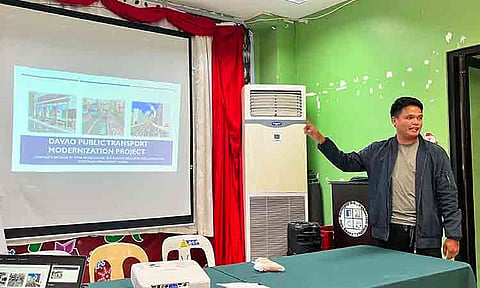 Caption
TRANSPORT MODERNIZATION. A project representative discusses the Davao Public Transport Modernization Project during an Information, Education, and Communication campaign at Barangay 2-A Hall in Poblacion District, Davao City. The modernization program aims to deploy more than 1,000 modern buses and introduce an integrated transport network across the city.