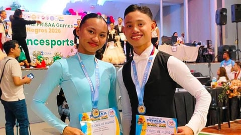 DAZZLING PAIR. Jesteve Eric Almendras and Joelie Mae Catamco of the Davao Region celebrate after dominating the youth standard dancesport events at the National Prisaa Games 2026. The pair captured six gold medals after ruling the waltz, tango, Viennese waltz, slow foxtrot and quickstep competitions.