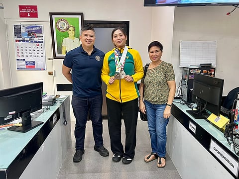 DAVAO CITY PRIDE. Ashley Rose Reniedo (center) joins Mikey Aportadera (left) during a courtesy call at the City Mayor’s Office in Davao City following her strong performances in international and UAAP taekwondo competitions.