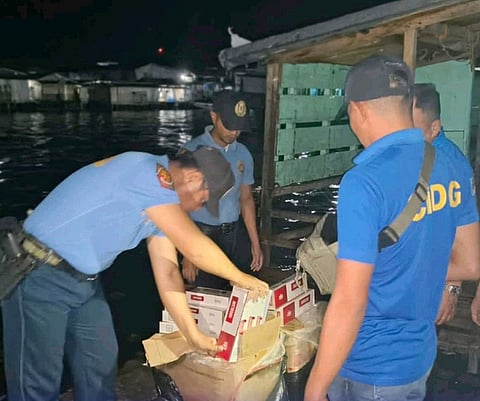 ZAMBOANGA. Personnel of the Philippine National Police-Maritime Group seize some P256,710 worth of smuggled cigarettes Thursday, May 21, at Gabang-Gabang Mini Port in Poblacion village, Bongao, Tawi-Tawi.