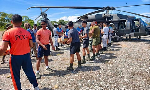 Disaster Response Teams of 73rd Infantry Battalion and other DRTs load Family Food Packs to PAF Black Hawk at Capitol Grounds, Lais, Malita, Davao Occidental bound to Brgy. Molmol, Jose Abad Santos, Davao Occidental on June 14, 2026.