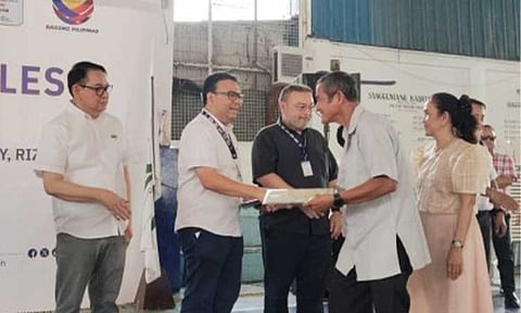 LAND TITLES AWARDING. Department of Human Settlements and Urban Development Secretary Jose Ramon Aliling leads the awarding of land titles to Sitio Sto. Niño de Pasig Homeowners Association, Inc. members in Antipolo City, Rizal on Thursday (June 26, 2026). A total of 133 families received their land titles after 38 years. (DHSUD photo)