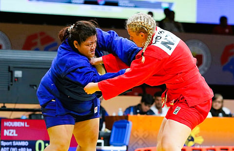 Defending champion Sydney Sy (left) grapples with New Zealand’s Lilly Houben in their women’s sport sambo +80kg semifinal match in the 11th Asia-Oceania Sambo Championships at the Ninoy Aquino Stadium on Friday, June 26, 2026.