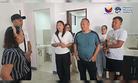 The family of the late basketball player Rene Clert “Bobet” Baterbonia visits their awarded unit at Madayaw Residences in Bangkal, Davao City on July 3, 2026, welcomed by National Housing Authority XI officials.