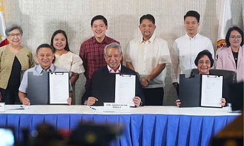 EARLY CHILDHOOD DEV’T. Education Secretary Juan Edgardo Angara, Interior Secretary Jonvic Remulla, and Early Childhood Care and Development (ECCD) Council Vice Chairperson and Executive Director Dr. Teresita Inciong (seated, left to right) sign the Implementing Rules and Regulations (IRR) of Republic Act 12199, or the Early Childhood Care and Development System Act, at the Quezon City Reception House on Aug. 5, 2026. The IRR strengthens the implementation of programs and services that support the holistic growth and development of young children. (PNA photo by Robert Oswald P. Alfiler)