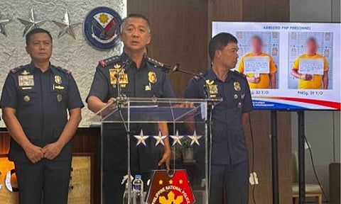 BUSTED. Philippine National Police Chief Gen. Jose Melencio Nartatez Jr. shows to the media on Thursday (Aug. 6, 2026) the mugshots of two police officers assigned in Caloocan City who will face dismissal proceedings after being arrested in a buy-bust operation for allegedly selling unlicensed firearms. He said the suspects will be charged for violating Republic Act 10591, the Comprehensive Firearms and Ammunition Regulation Act, as well as administrative charges. (PNA photo by Lloyd Caliwan)