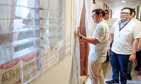 President Ferdinand R. Marcos Jr. (center) inspects a housing unit window during his visit to the People’s Ville housing project under the Expanded Pambansang Pabahay para sa Pilipino (4PH) Program in Calinan District in Davao City. Marcos committed to constructing 42 additional buildings at the site by late 2027 to address the local housing shortage.