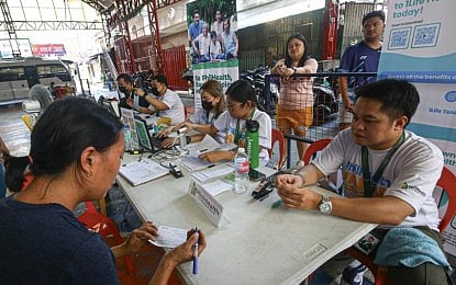 PRIMARY CARE. Residents register for the PhilHealth YAKAP (Philippine Health Insurance Corporation-Yaman ng Kalusugan Program) caravan free services in Barangay San Vicente in U.P. Village, Quezon City on May 12, 2026. Available services are PhilHealth registration, member assistance and orientation; and free medical consultations and medicines, mainly benefiting indigent residents and senior citizens. (PNA photo by Joan Bondoc)