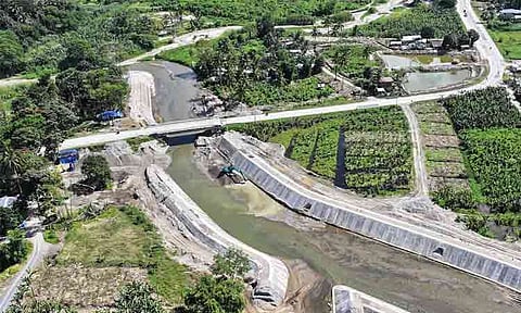 An aerial view displays a newly constructed flood control project along a critical section of the Agusan River in Barangay Mapawa, Maragusan, Davao de Oro. The Department of Public Works and Highways (DPWH) engineered the concrete revetment walls and slope protection to shield adjacent agricultural lands from overflowing waters, securing the livelihoods of local farmers and safeguarding nearby roadway infrastructure.