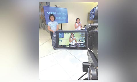 REPORTING. Talisay City Central School student Arya Ocat delivers her report in front of the camera during the TV Broadcasting workshop of SunStar Cebu’s Junior Journo Training at SM Seaside City Cebu on Aug. 15, 2026. / IRISH SEVILLA