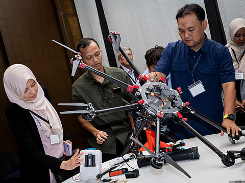 Participants inspect a drone at the Capstone Workshop and Combined Tabletop Exercise hosted by the State Department’s Bureau of Arms Control and Nonproliferation (Office of Weapons of Mass Destruction Response and Planning) and the Philippines’ Anti-Terrorism Council Program Management Center from August 24 to 28 in Manila. Contributed