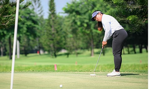 EARLY FAVORITE. Davao City’s Yvon Bisera practices her putting ahead of the ICTSI Summit Point Championship at Summit Point Golf and Country Club in Lipa City, Batangas. The tournament opens Sept. 8, with Bisera seeking her third Ladies Philippine Golf Tour title of the season before making her Korean LPGA Tour debut later this month.