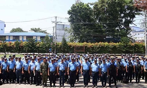 Davao City Police Office (DCPO) Director Police Colonel Peter Bauzon Madria inspects rows of police personnel during a formal send-off ceremony. The officers are deployed as augmentation forces to the Police Regional Office-Bangsamoro Autonomous Region (PRO-BAR) to secure the regional elections in the Bangsamoro Autonomous Region in Muslim Muslim Mindanao.