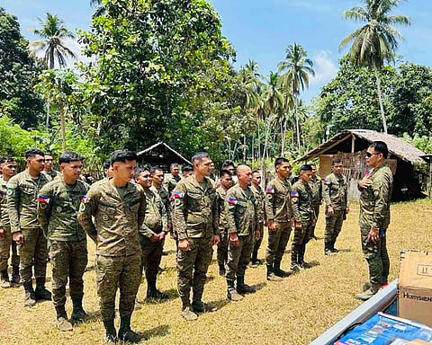 ZAMBOANGA. Brigadier General Alaric Avelino Delos Santos, 1102nd Infantry Brigade commander (right), talks to members of the militia when he distributes solar power systems on Wednesday, September 9, when he visits seven militia patrol bases in the remote areas in the province of Sulu.