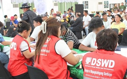 CRISIS ASSISTANCE. Department of Social Welfare and Development (DSWD) personnel assist former rebels receiving cash aid under the Assistance to Individuals in Crisis Situations (AICS) program in Catbalogan City, Samar, on May 4, 2026. The Marcos administration is proposing PHP33.285 billion for the AICS program under the 2027 National Expenditure Program (NEP), representing a 23.15-percent increase from the amount originally proposed in the 2026 NEP. (Photo courtesy of DSWD)